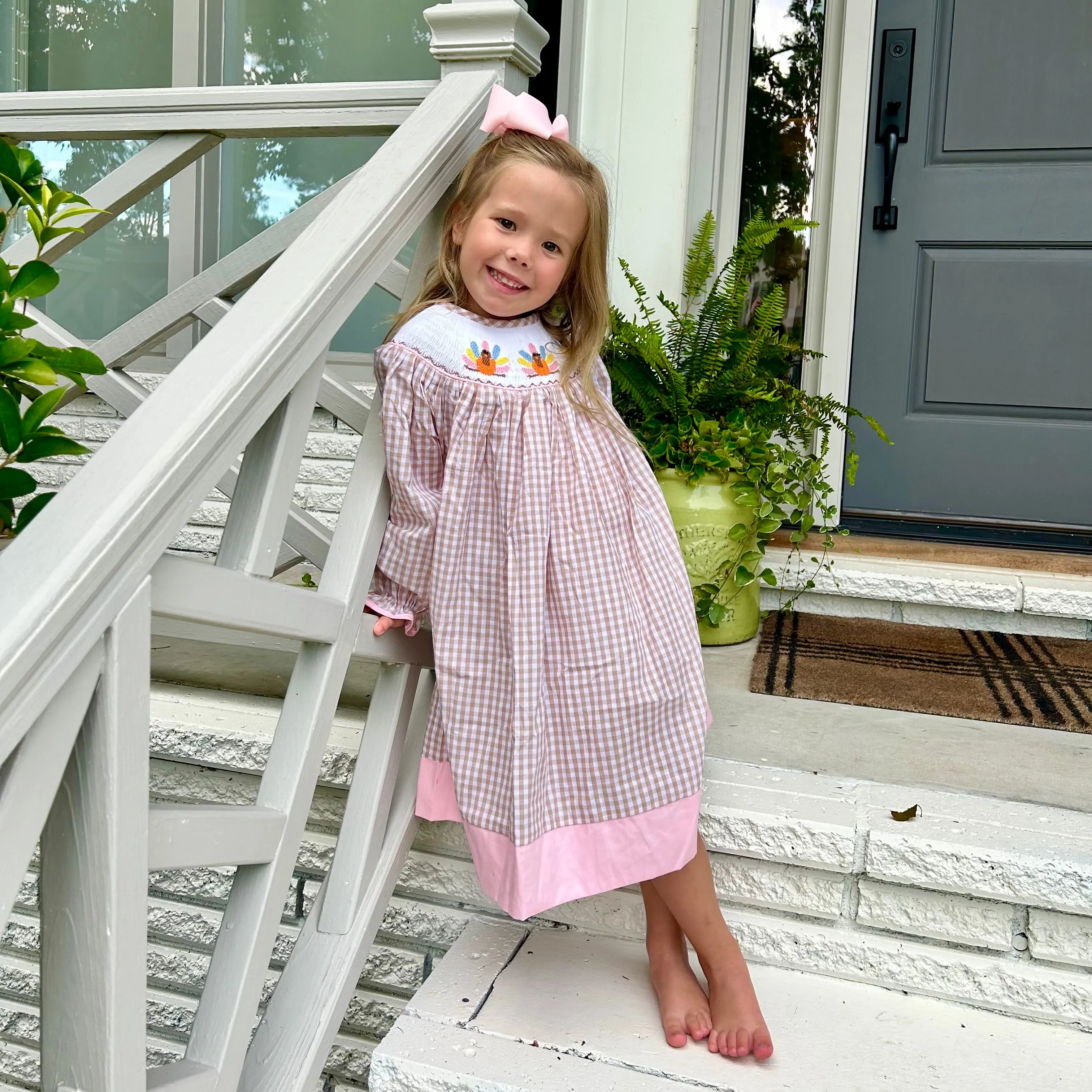 Smocked Turkey Bishop Dress in Tan and Pink!